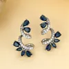 Boucles d'oreilles en pierre bleu Royal pour femmes, coupe poire, fleur, couleur argent, Zircon de luxe, bijoux de mariage, cadeaux de mariée