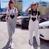 Kvinnors jumpsuits rompers ungdom ny stil heta försäljning mode overall kvinnor 2023 sommar koreansk version lös västerländsk persika hjärta casual hiphop kvinnor kläder stekt st