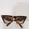 Frauen Mode Sonnenbrille 41468 Katzen Augenstil Acetat Rahmen Frauen Personalisierte Sonnenbrille im Freien französische Mode klassische Landebahnstil mit Kette