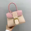 New Delvo Brillant ColorBlock Handheld Horseshoe Buckle Wrap Head Layer Cowhide Womens Handbag Sale 60% rabatt på butik online