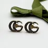 Modieuze en charmante zwarte steenbrons designer oorbellen. Hoogwaardige sieraden voor kerst- en Valentijnsdagcadeaus.