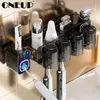 Toothbrush Holders ONEUP Wall Mounted Toothbrush Holder Dustproof Automatic Toothpaste Squeeze Dispenser Makeup Storage Rack Bathroom Accessories 230918