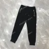 22ss Pantaloni firmati da donna da uomo Cerniera con etichetta triangolare in metallo Tasca in nylon Pantaloni da uomo in tessuto nero bianco xinxinbuy S-XL319s