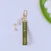 Porte-clés tendance de luxe de luxe pendentif clé boucle classique lettre tissu perles chaîne 4 styles porte-clés de haute qualité Ornamen301j