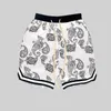 Mäns shorts sommaren 2023 och kvinnors beskurna avslappnade mini-stretch rak rep Cashew Flower Loose Sport Trend Beach Pants