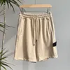 2023 Shorts de verão masculino calças curtas moda correndo solto processo de lavagem de secagem rápida de tecido puro na moda casual hip-hop pedras ilha shorts q6hB #