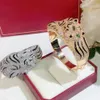 Braccialetti con ciondoli Tendenza di vendita Bracciale tigre esagerato Neutro AAA Zircone Partito Stampa leopardata Gioielli di marca Moda di strada Dorato 230919