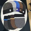 Europeiska designer snö beanies kvinnor män vinter ull mössor med kontrollerad stickad mode skid cap unisex märke skalle mössor varm hatt