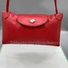 Bolinho crossbody bolsa tiktok sacos on-line popular transmissão ao vivo quente pele de cordeiro venda feminina camada superior envelope saco de praia