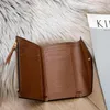 Klassisk Victorine Purse Emilie -knapp Kvinnor Korta plånböcker visar exotisk läderpåse Round Coin Purses Card Holder M623602708