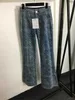 Designerjeans Frauen Mode gestreifte Taschendekoration Kamellien Plaid Druck hoch taillierter blauer Denim Flare Hosen Herbst und Winter Frauenkleidung