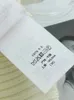 Maglioni da donna Moda donna Lana Backless Tie Back Maglione per le donne 2023 Fasciatura bianca di alta qualità con bottoni sulla spalla Maglia a coste