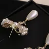 Pendiente de tuerca de alta calidad con diamante y perla blanca para mujer, joyería de boda, regalo con forma de nudo de caja PS3219211o