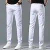 Jeans pour hommes Designer Printemps / Été Élastique Slim Fit Petits Pieds Casual Mode Polyvalent Jeunes Pantalons Longs Brodés OA1E