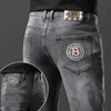 Jeans pour hommes Designer automne et hiver nouvelle lumière de luxe édition coréenne épais pieds élastiques coupe ajustée mode gris fumée SEZG