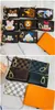 العلامة التجارية الفاخرة Women Key Wallets Brown Letter Key Pouch Pochette Cles Designers Cartoon Animal Lion Duck Bear Coin Poundes Woolets Wallets مع سحر مفاتيح السلسلة