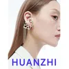 Boucles d'oreilles Huanzhi noir blanc puzzle gland créatif creux huile goutte à goutte métal oreille clips Y2K personnalisé punk bijoux pour femmes