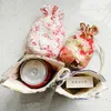 Envoltura de regalo Flores de cerezo Bolsa de tela de fondo redondo Bolsa de cordón de lino de algodón chino Pequeña joyería Bolsas de embalaje reutilizables