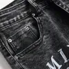 Jeans da uomo con foro strappato pentagramma ricamato piccolo piede pantaloni in denim stile punk streetwear pantaloni hip-hop maschili