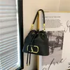 Nuevo bolso de diseñador de lujo para mujer, bolso tipo cubo con cordón de gran capacidad de Metal de Color sólido, bolso bandolera a la moda, bolso cruzado