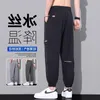 Mäns jeans Ice Silk Pants Summer Thin Quick Dried Sports Stor storlek Junior High School -elever Loose Bundna Work Wear Casual