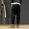 Jeans da uomo Stile giapponese Moda Uomo Loose Fit Spliced Designer Pantaloni cargo Hombre Harem Streetwear Hip Hop Joggers317x