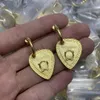 Le donne amano gli orecchini a bottone in ottone pieno di diamanti, stile versatile, ritratto di Medusa, famiglia di fan, orecchini a forma di cuore di pesca, gioielli MER39