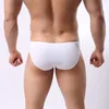 Slip Mutandine Scroto Foro Pene Elefante Tubo Slip Uomo Mutandine di seta ghiaccio Intimo uomo Gay Vita bassa Custodia Slip sexy Mutande maschili Marca 230920