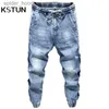 Mäns jeans överdimensionerade jeans män harem byxor brett ben lös passform avsmalnande jeans manliga joggar hip hop streetwear elastiska midja byxor för män l230921