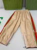 Pantalones de alta calidad para niña y niño, talla 100-160 CM, pantalones de bebé con costuras a rayas multicolores laterales, pantalones de moda para niños Sep20