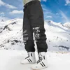 Calças de esqui masculinas inverno oversize quente à prova de vento à prova dwindproof água macacão de neve respirável solto snowboard calças 230920