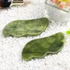 أداة الوجه Gua Sha Draging Tool Sawtooth Natural Jade Stone Guasha Board Massager لمكافحة التخسيس الوجه والرقبة إزالة التجاعيد انتفاخ العين