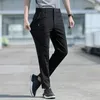 Pantaloni da uomo larghi estivi di grandi dimensioni in seta di ghiaccio elasticizzati traspiranti gamba dritta 8XL pantaloni neri con fascia elastica ad asciugatura rapida