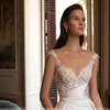 Abiti da cerimonia nuziale eleganti a sirena in pizzo con fiori eleganti Abito da sposa con strascico staccabile Abito da sposa con collo trasparente per la sposa