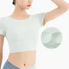 Chemises actives T-shirts Sport Fille avec coussin de poitrine Vêtements d'entraînement en plein air Beauté Dos Solide Yoga Haut à manches courtes Respirant Séchage rapide