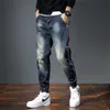 Jeans da uomo Jeans da uomo Pantaloni Harem Tasche alla moda Desinger Vestibilità ampia Jeans larghi da moto Uomo Stretch Retro Streetwear Jeans affusolati rilassati 230920