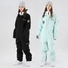 Ternos de esqui terno de esqui impermeável e respirável calças de snowboard jaqueta mulheres homens roupas de neve inverno workwear 230920