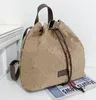 Zaino All-match Borsa a secchiello Etichetta completa Lettera Zaino di grande capacità Cintura a strappo Borse casual per uomo e donna dello stesso stile