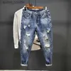 Jeans da uomo Pantaloni da cowboy da uomo strappati con stampa Pantaloni grafici con fori rotti strappati Estetici affusolati Harajuku Classic Buggy Xs Jeans da uomo L230927