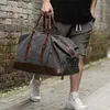 Duffel Çantalar Retro Tuval Taşıyor Çanta Seyahat Erkek Moda Trendi Büyük Kapasite Bagajı Bir Omuz Sırt Çantası