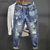 Jeans da uomo Pantaloni da cowboy da uomo strappati con stampa Pantaloni grafici con fori rotti strappati Estetici affusolati Harajuku Classic Buggy Xs Jeans da uomo L230927