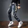 Mäns jeans herrar jeans harem byxor modefickor desering löst fit baggy moto jeans män sträcka retro streetwear avslappnade avsmalnande jeans l230921