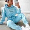 Herrtröjor tröjor lös stil tröja skörd topp kvinnor två stycken uppsättning 2023 höst vinter mode långärmad huva sport casual tracksuit för lady t230921