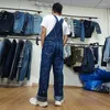 Herr jeans mode amerikanska cowboy haklappar lösa baggy plus storlek jumpsuits unga män kvinnor denim målar personliga overaller byxor