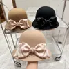 2023 New high-end ladies ribbon bow wool basin hat ~ French elegant small fragrance designer fisherman hat autumn and winter temperament warm felt hat