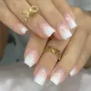 False Nails 24pcs 못 전체 커버 가짜 우아한 핑크 그라디언트 반짝이 프랑스 짧은 관호 230922