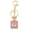 Moda criativa diamante pingente automático chaveiro garrafa de perfume chaveiro feminino pingente acessórios 264m