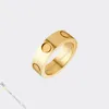 Anillo de diseñador Diseñador de joyas para mujeres Amantes Anillos de banda Anillo de acero de titanio Chapado en oro Nunca se desvanece No alérgico Oro Plata R2980