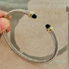 Bangle Cable Classic Collection Bracelet مع Topaz Blue و Black Onyx 18K Gold245C