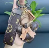 Projektantka klucza portfela pierwiastka torebka łańcuch samochodowy Charm Bucket Bag Flower Mini Monety Uchwyt klekowy Bag Trek Trinket Prezenty Akcesoria